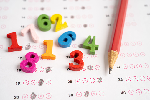 Math number and pencil on answer sheet paper, Education study testing learning teach concept.