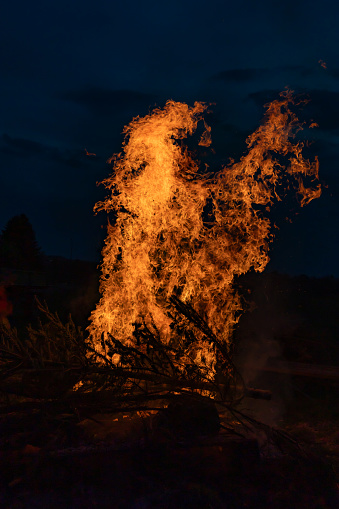 Bonfire burning in the yard at night, beautiful texture of burning fire