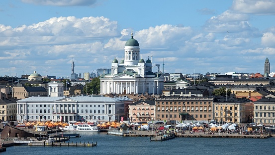 An aerial view of Helsinki, Finland with boats in the foreground against the cityscape