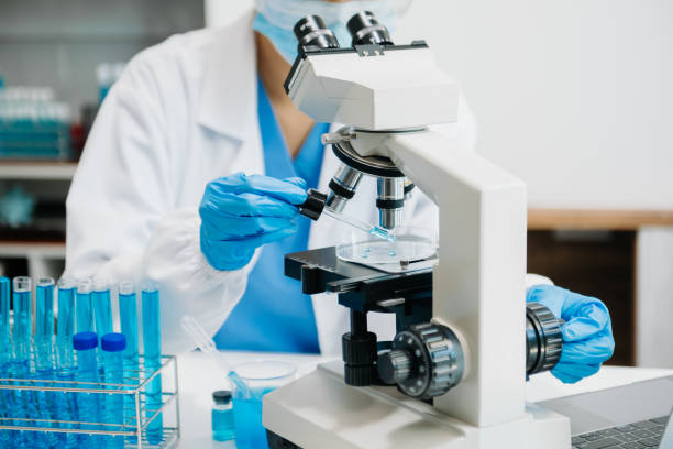 istock Modern medical research laboratory. female scientist working with micro pipettes analyzing biochemical samples, advanced science chemical laboratory 1733025665