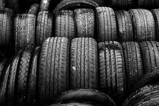 Car tires at warehouse in tire store.black and white tone ,black and white