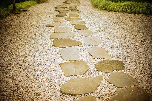 Stone footpath on small stone in garden