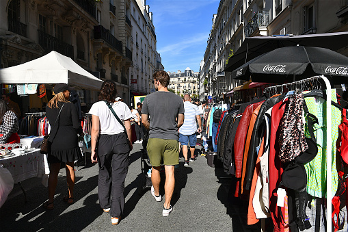 Paris, France-10 01 2023: Bargain hunters in a flea market on a street of Paris, France.