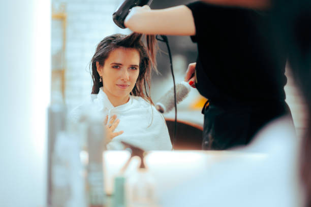 istock Skillful Hairstylist Blow Drying Hair using Professional Tools 1733072534