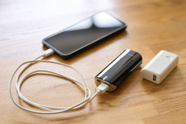 Mobile battery that charges your smartphone Mobile battery that charges your smartphone portable power bank stock pictures, royalty-free photos & images