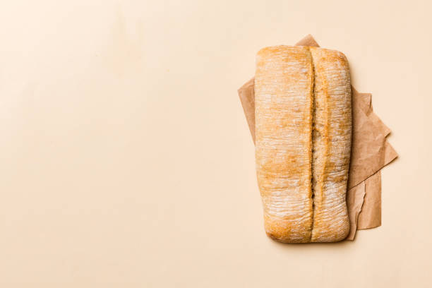 istock Fresh ciabatta bread on napkin on rustic background, Italian bread top view 1733104786