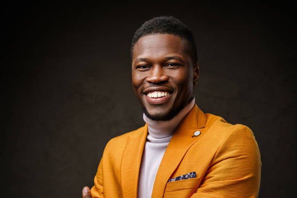 istock Stylish dark-skinned man wearing a yellow blazer 1733110631