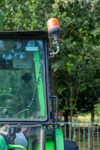 partial view of the cab of an old tractor, agricultural machinery concept