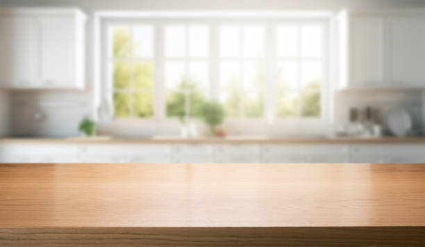 istock empty brown wooden counter for product display on blurred white home kitchen interior background 1733114482