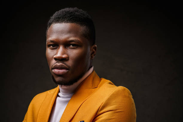 istock Stylish dark-skinned man wearing a yellow blazer 1733116683