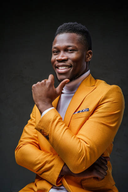 istock Stylish dark-skinned man wearing a yellow blazer 1733117295