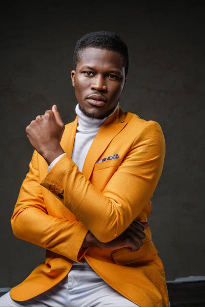 istock Stylish dark-skinned man wearing a yellow blazer 1733118405