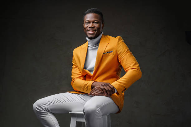 istock Stylish dark-skinned man wearing a yellow blazer 1733121722
