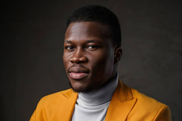 istock Stylish dark-skinned man wearing a yellow blazer 1733127186