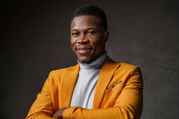 istock Stylish dark-skinned man wearing a yellow blazer 1733127982