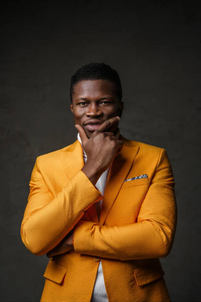 istock Stylish dark-skinned man wearing a yellow blazer 1733129455