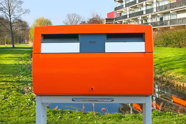 istock Dutch public orange mailbox on a city street. Netherlands 173312995
