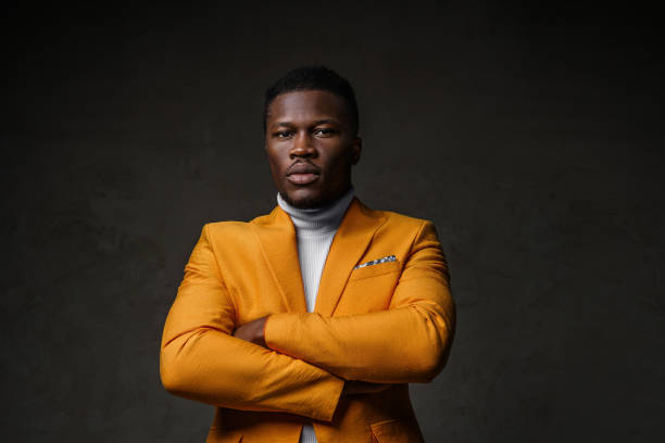 istock Stylish dark-skinned man wearing a yellow blazer 1733130088