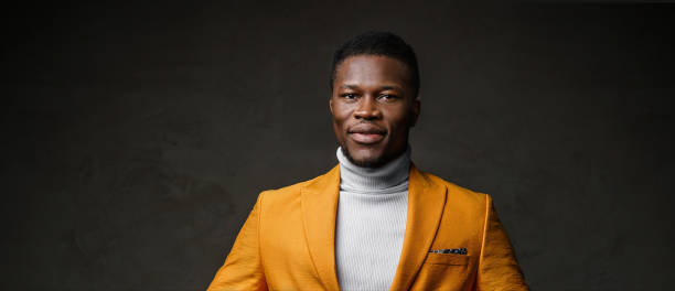 istock Stylish dark-skinned man wearing a yellow blazer 1733134552