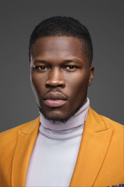 istock Stylish dark-skinned man wearing a yellow blazer 1733151853