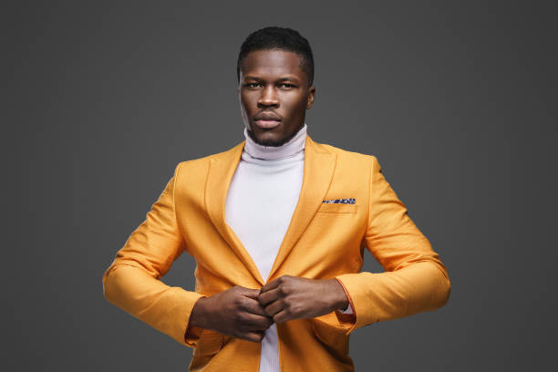 istock Stylish dark-skinned man wearing a yellow blazer 1733153532