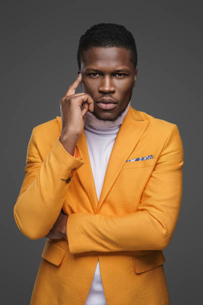 istock Stylish dark-skinned man wearing a yellow blazer 1733154086