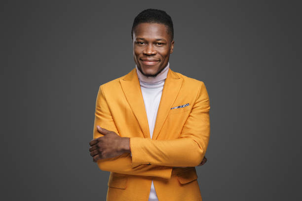 istock Stylish dark-skinned man wearing a yellow blazer 1733155715