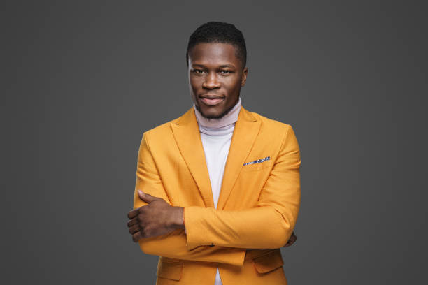 istock Stylish dark-skinned man wearing a yellow blazer 1733156849