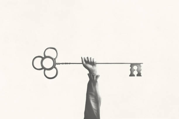 istock Illustration of a hand holding up a medieval golden key, success concept 1733157040
