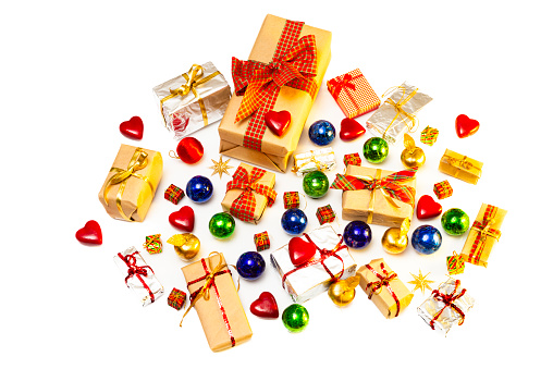 High angle view of Christmas gift boxes with ornaments on white background