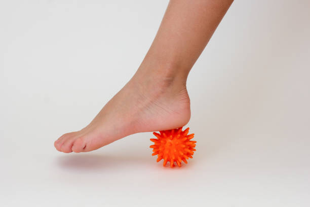 istock Cropped child leg doing exercises with spiky needle ball 1733184556