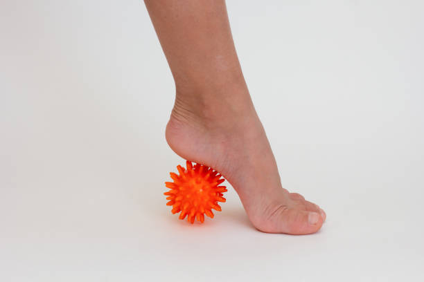 istock Cropped child leg doing exercises with spiky needle ball 1733185790