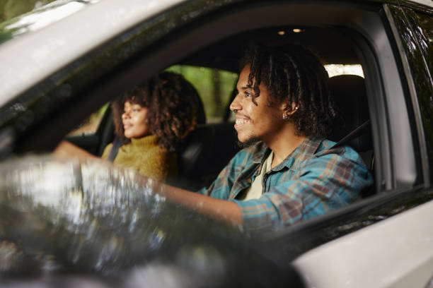 istock Happy black couple going on a trip by car. 1733190815