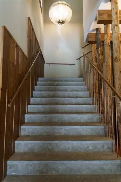 Photo of Vertical of a staircase leading upstairs