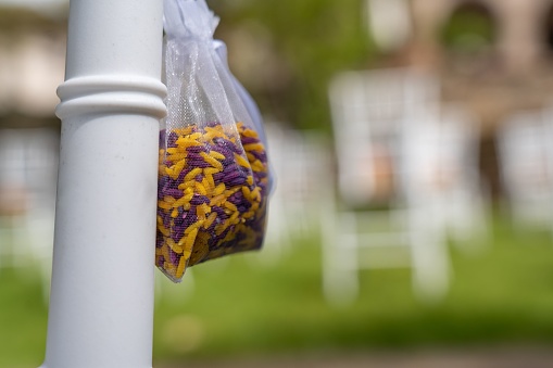A closeup of a sealed bag filled with colorful flower petals