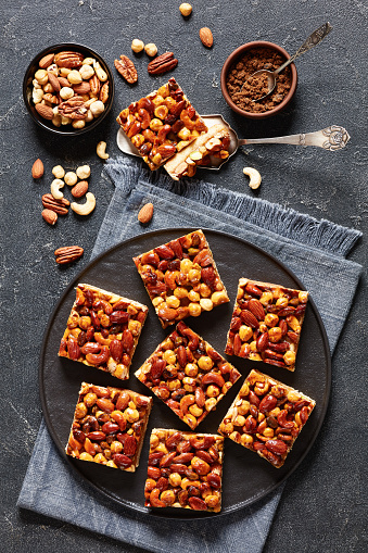 istock toffee mixed nuts shortbread bars on black plate 1733194738