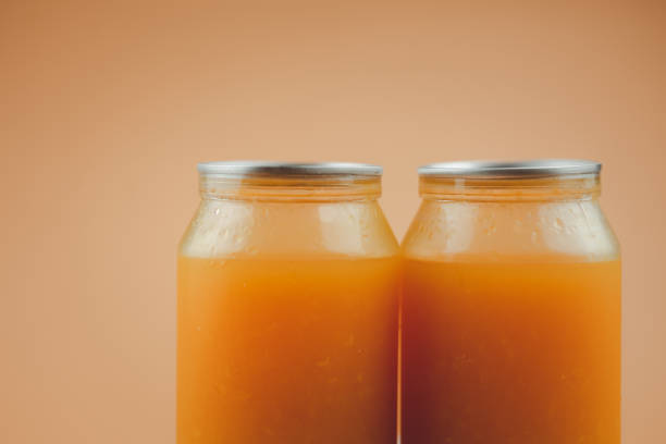 istock Fresh orange juice in plastic bottle cup. 1733204487