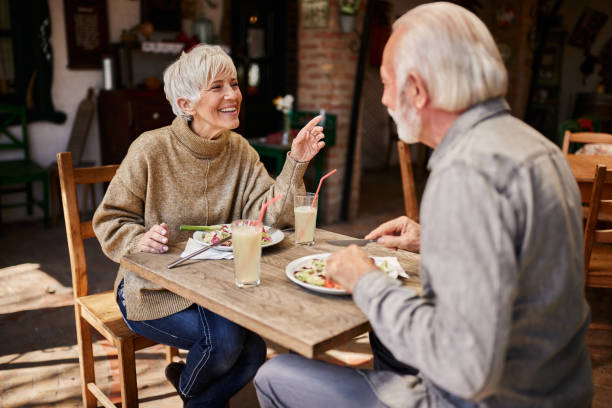 istock Happy senior couple talking during a meal in a restaurant. 1733210434