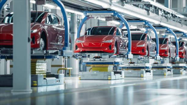 ev production line on advanced automated smart factory. high performance electric car manufacturing. car batteries installation on electric vehicles on assembly line. automotive plant. - monteringsband bildbanksfoton och bilder