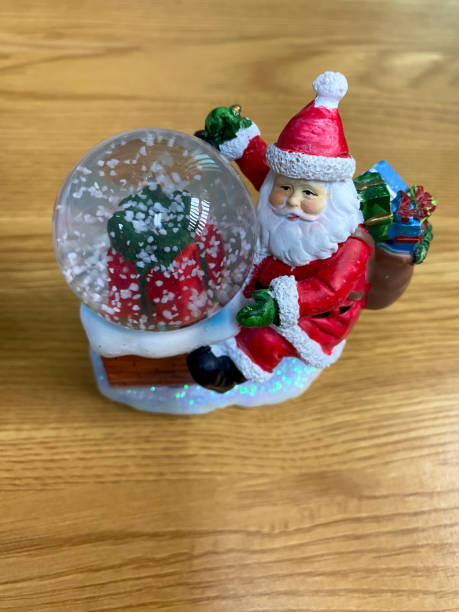 istock Santa Claus decoration with snow globe 1733245180