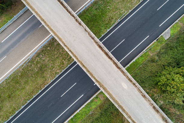 istock drone aerial view of an overpass over a freeway 1733252131