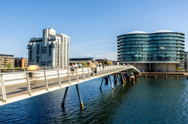 Pedestrian bridge with cyclists in Copenhagen, long exposure. people are not recognizable