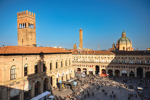 Bologna, Italy - March 5, 2023: High angle view on Piazza Maggiore with historical buildings and towers on a clear day in the center of Bologna, Italy