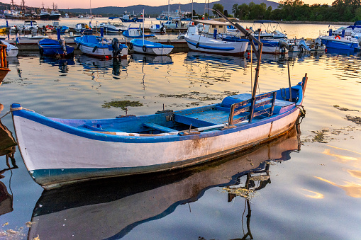 Fishing boats at the pier in Sozopol at sunset