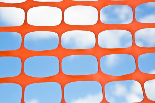 Plastic safety grid in construction site areas for the protection of construction activities