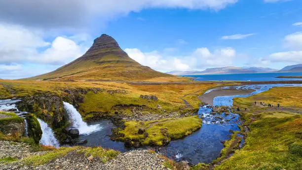 The famous Kirkjufell with Kirkjufellfoss Waterfall in Autumn located on the north coast of Iceland, Snæfellsnes peninsula