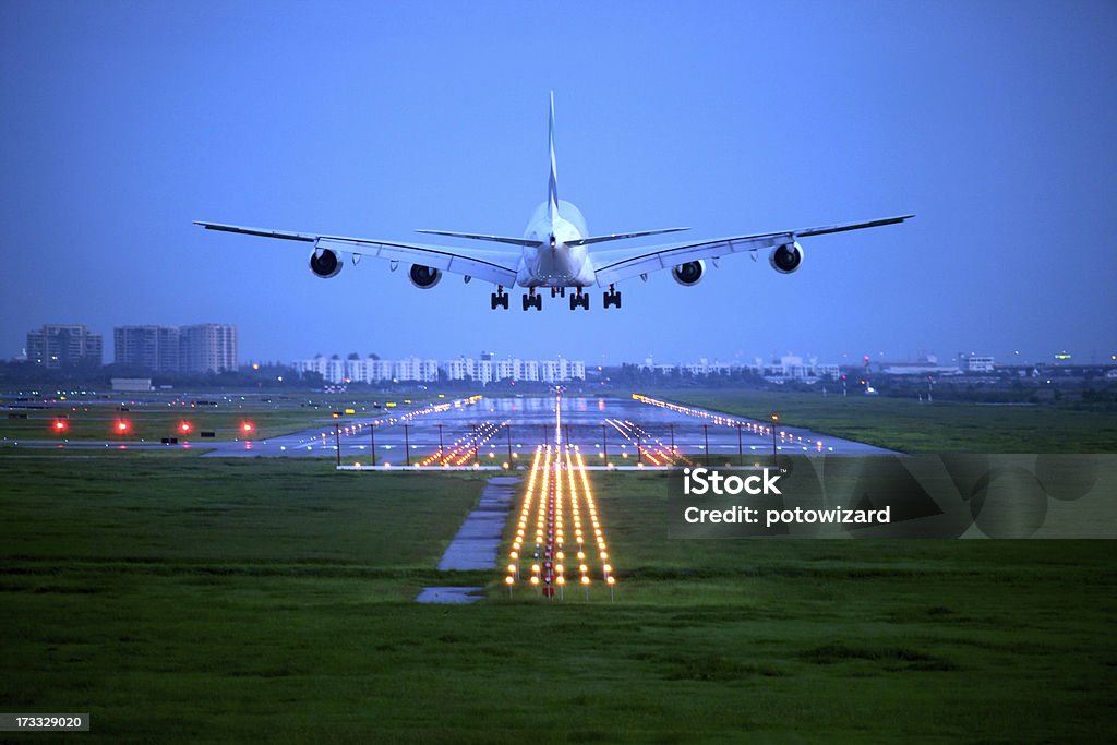 airplane passenger plane fly up over take-off runway from airport Airplane Stock Photo