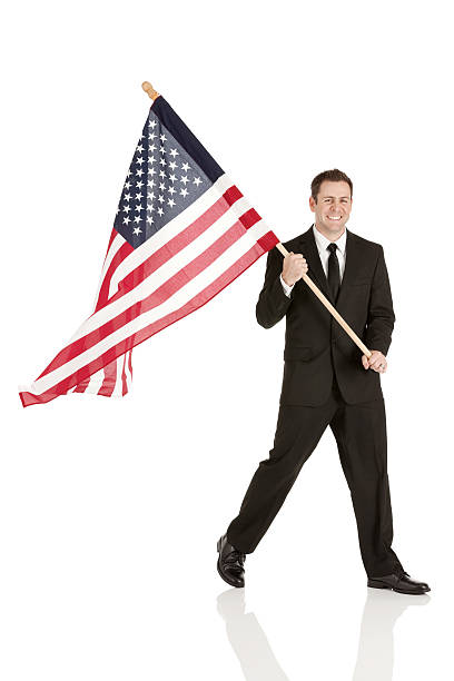 istock Smiling young businessman with a flag 173329058