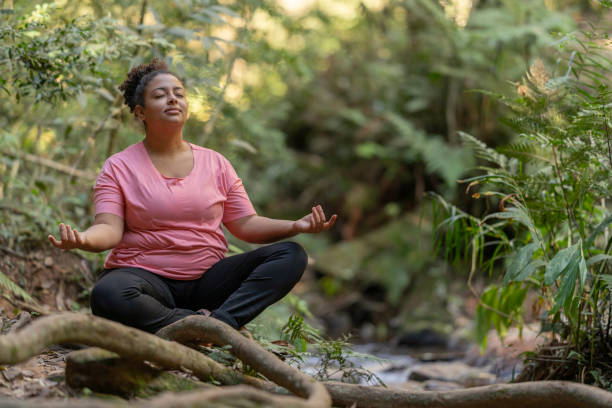 istock Woman meditating in nature 1733329427