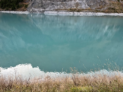 The reservoir lake Panixersee (Lag da Pigniu) or Panixer Lake on the slopes of the Glarus Alps mountain massif, Pigniu-Panix - Canton of Grisons, Switzerland (Kanton Graubünden, Schweiz)